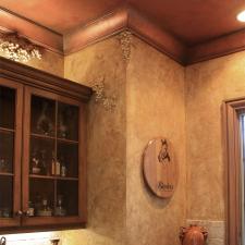 Faux grapes over sculpted over Liquor cabinetand wine room